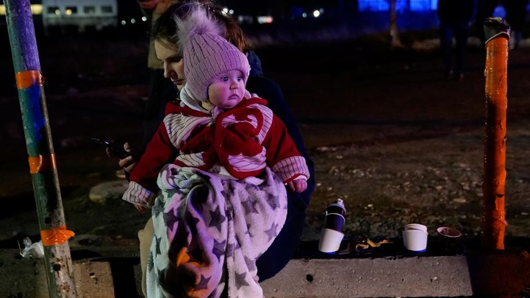 A mother and her baby, trying to flee Ukraine for Poland