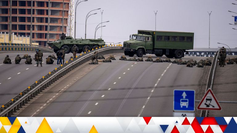 Ukrainian soldiers take position on a bridge inside the city of Kyiv, Ukraine
PIC:AP