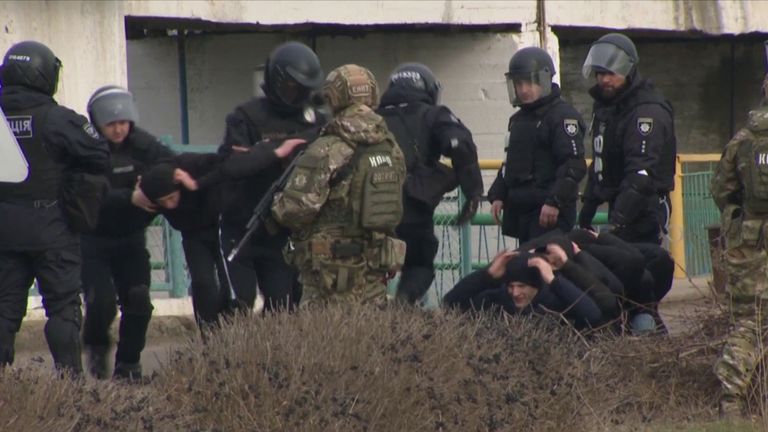Ukraine&#39;s President watched as military and volunteers practiced staged attacks in preparation of a potential Russian invasion.
