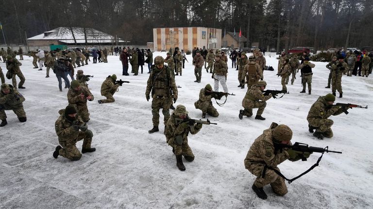 Members of Ukraine&#39;s Territorial Defence Forces training close to Kyiv on Saturday. Pic: AP