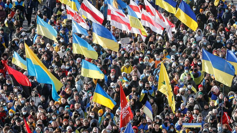 People take part in the Unity March, which is a procession to demonstrate Ukrainians&#39; patriotic spirit amid growing tensions with Russia, in Kyiv, Ukraine February 12, 2022. REUTERS/Valentyn Ogirenko