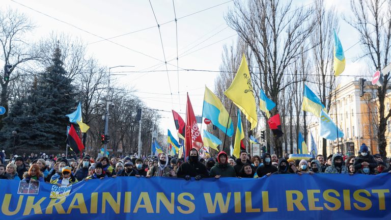 People take part in the Unity March, which is a procession to demonstrate Ukrainians&#39; patriotic spirit amid growing tensions with Russia, in Kyiv, Ukraine February 12, 2022. REUTERS/Valentyn Ogirenko