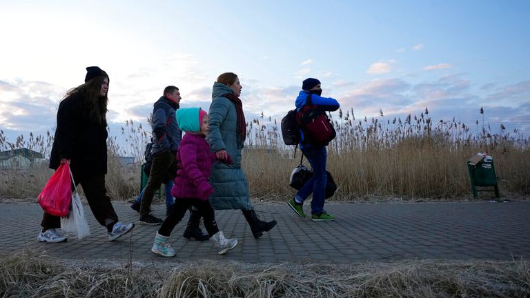 Refugees fleeing conflict in Ukraine arrive to Przemysl, Poland, Sunday, Feb. 27, 2022. Street fighting broke out in Ukraine&#39;s second-largest city Sunday and Russian troops put increasing pressure on strategic ports in the country&#39;s south following a wave of attacks on airfields and fuel facilities elsewhere that appeared to mark a new phase of Russia&#39;s invasion.