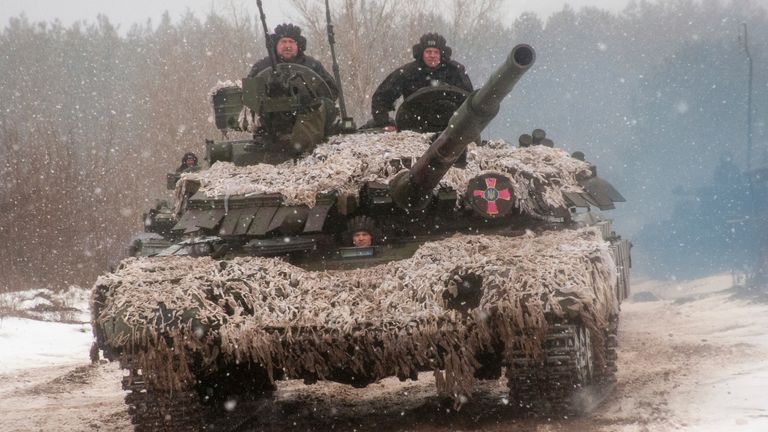 A Ukrainian tank moves during military drills close to Kharkiv, Ukraine, Thursday, Feb. 10, 2022. Britain&#39;s top diplomat has urged Russia to take the path of diplomacy even as thousands of Russian troops engaged in sweeping maneuvers in Belarus as part of a military buildup near Ukraine. 