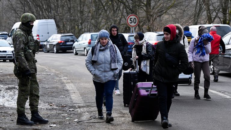 People fleeing from Ukraine arrive in Slovakia, after Russia launched a massive military operation against Ukraine, in Ubla, Slovakia, February 26, 2022. REUTERS/Radovan Stoklasa