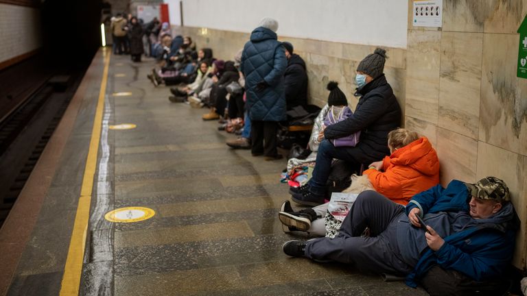 People lie in the Kyiv subway, using it as a bomb shelter in Kyiv, Ukraine, Thursday, Feb. 24, 2022. (AP Photo/Emilio Morenatti)


