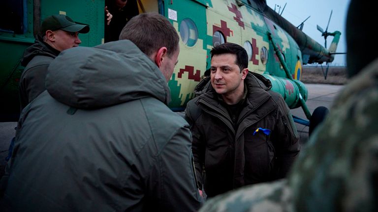 In this handout photo provided by the Ukrainian Presidential Press Office, Ukrainian President Volodymyr Zelenskyy greets leaves a military helicopter as he arrives to inspects Ukrainian coast guard in Mariupol, Donetsk region, eastern Ukraine, Thursday, Feb. 17, 2022. 
PIC:AP