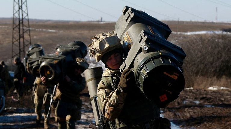 Service members of the Ukrainian Armed Forces carry weapons during military drills at a firing ground in the Donetsk region, Ukraine, February 15, 2022. Picture taken February 15, 2022. General Staff of the Ukrainian Armed Forces/Handout via REUTERS ATTENTION EDITORS - THIS IMAGE HAS BEEN SUPPLIED BY A THIRD PARTY.
