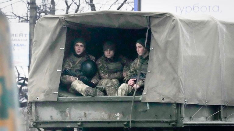 Ukrainian soldiers ride in a military vehicle in Mariupol, Ukraine, Thursday, Feb. 24, 2022. Ukraine&#39;s border guard agency says that the Russian military has attacked the country from neighboring Belarus. The agency said that the Russian troops unleashed artillery barrage as part of an attack backed by Belarus. (AP Photo/Sergei Grits)
PIC:AP