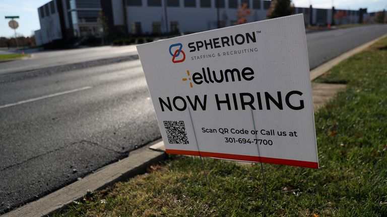 A hiring sign is posted across the street near Ellume buildings that are under construction in Frederick, Maryland, U.S., November 18, 2021. 