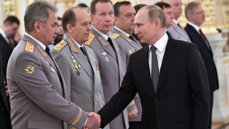 Russian President Vladimir Putin shakes hands with Defence Minister Sergei Shoigu next to director of Russia’s Federal Security Service Alexander Bortnikov and head of Russia's National Guard Viktor Zolotov, during a promotion ceremony for senior officers and prosecutors in Moscow, Russia April 11, 2019. Sputnik/Alexei Nikolsky/Kremlin via REUTERS ATTENTION EDITORS - THIS IMAGE WAS PROVIDED BY A THIRD PARTY.