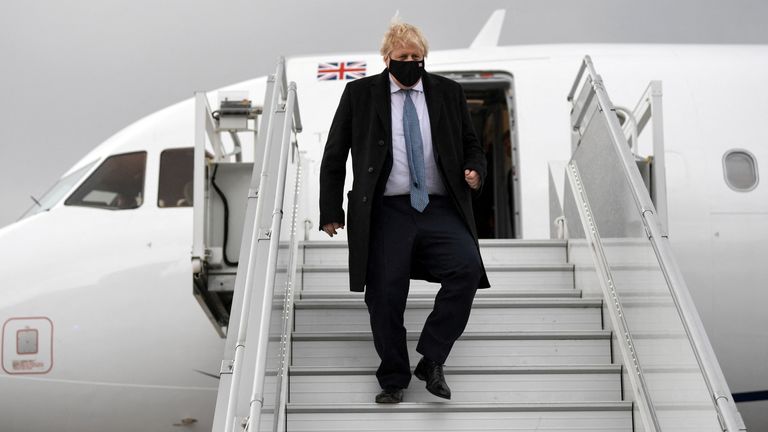 Britain&#39;s Prime Minister Boris Johnson disimbarks from the plane upon his arrival in Warsaw, Poland Februray 10, 2022. Daniel Leal/Pool via REUTERS
