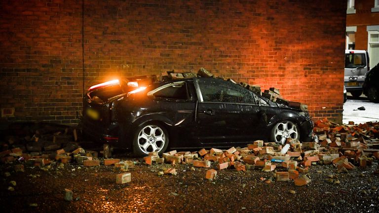 *PLEASE BLUR NUMBER PLATE*..A parked car has been left completely crushed after strong winds blew the outside bricks off a house in Salford...The incident saw the bricks detach from the side wall of a home on Horsham Street, Weaste, landing directly on top of a car on neighbouring Newport Street...Caption: Bricks were blown off a house on Horsham Street in Weaste, Salford, onto a parked car on Newport Street during Storm Dudley on 16 February 2022
PIC:MANCHESTER EVENING NEWS