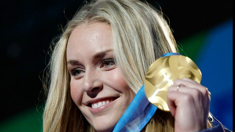 Vonn shows the gold medal she won in the women&#39;s downhill ski race at the Vancouver 2010 Olympics in Whistler, British Columbia