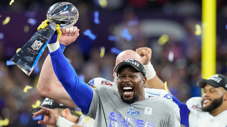 Los Angeles Rams outside linebacker Von Miller holds up the Lombardi Trophy after the Rams defeated the Cincinnati Bengals 