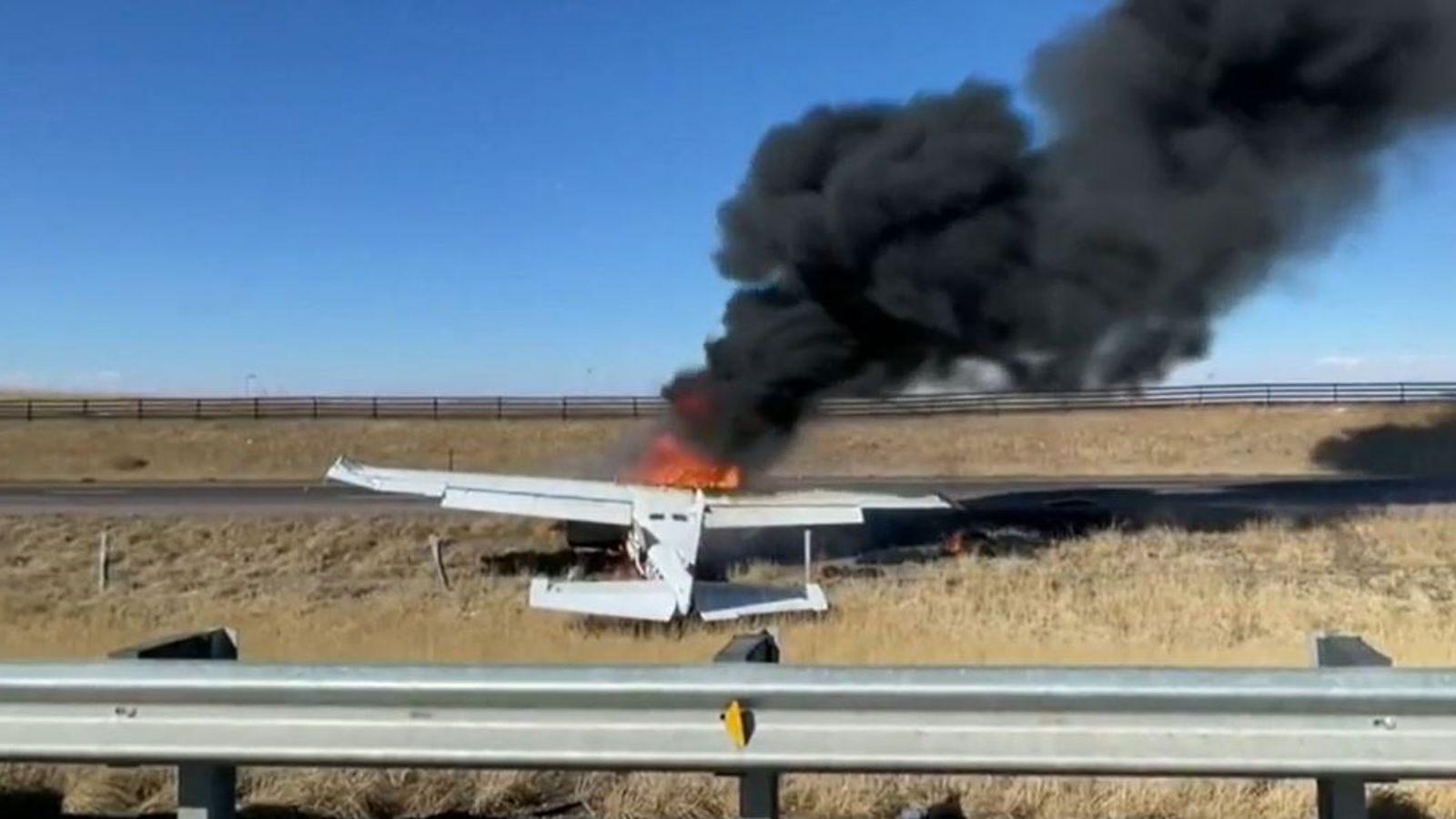 Miraculous escape for pilots and drivers as plane crashes on busy