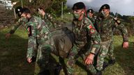 Members of the Portuguese military arrange an evacuation centre in Calheta, Sao Jorge island