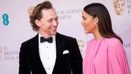 Tom Hiddleston and Zawe Ashton on the BAFTA red carpet - where eagle-eyed fans spotted an engagement ring. Pic: AP/Vianney Le Caer/Invision