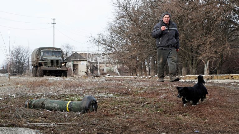 A local resident walks past a destroyed Javelin missile system in the separatist-controlled village of Anadol during Ukraine-Russia conflict in the Donetsk region, Ukraine March 10, 2022. REUTERS/Alexander Ermochenko
