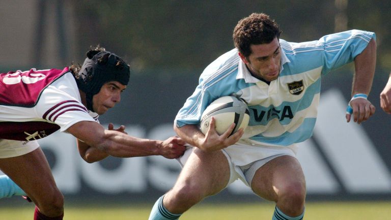 Argentine Los Pumas&#39; Federico Aramburu (R) is tackled by Venezuelan Carlos Barboza during the first half of their rugby match in Santiago, May 1, 2004. Argentina, Uruguay, Venezuela and Chile are participating in the South American Rugby tournament in Chile. Argentina won the match 147-7 and won the tournament. REUTERS/Carlos Barria CB/HB
