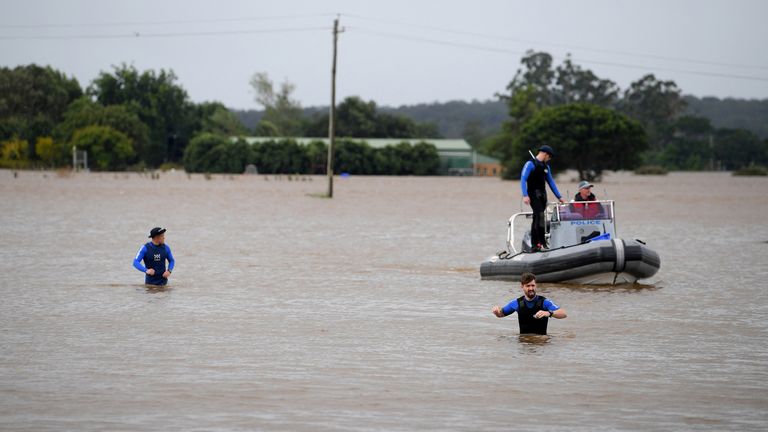 NSW Police Rescue are seen patrolling in floodwater at Windsor, north west of Sydney