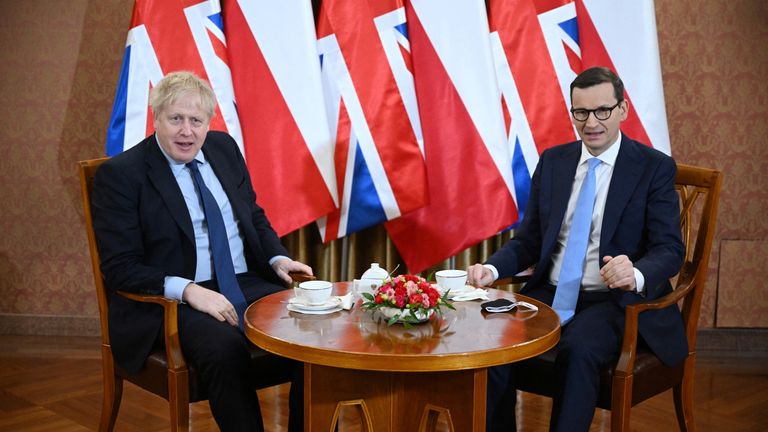 British Prime Minister Boris Johnson sits with Polish Prime Minister Mateusz Morawiecki at the Chancellery in Warsaw, Poland March 1, 2022. Leon Neal/Pool via REUTERS
