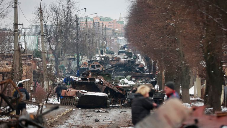The gutted remains of Russian military vehicles fill a road in the town of Bucha. Pic: AP