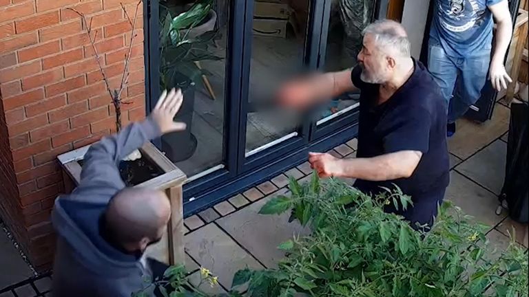 A pixellated still from CCTV shows Can Arslan (C) clashing with off-duty police sergeant Steve Wilkinson (L) at the home of Peter Marsden (R)