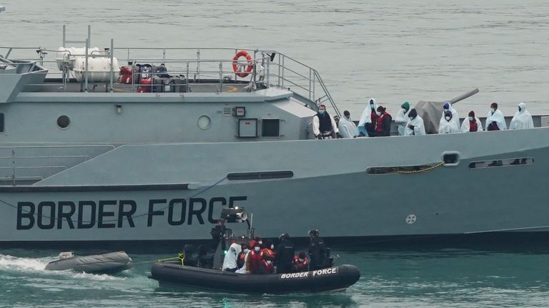 a group of people believed to be migrants are brought to Dover, Kent, by Border Force officers