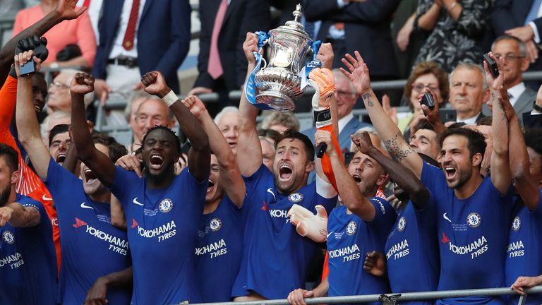 Soccer Football - FA Cup Final - Chelsea vs Manchester United - Wembley Stadium, London, Britain - May 19, 2018 Chelsea&#39;s Gary Cahill lifts the trophy as they celebrate winning the final REUTERS/David Klein
