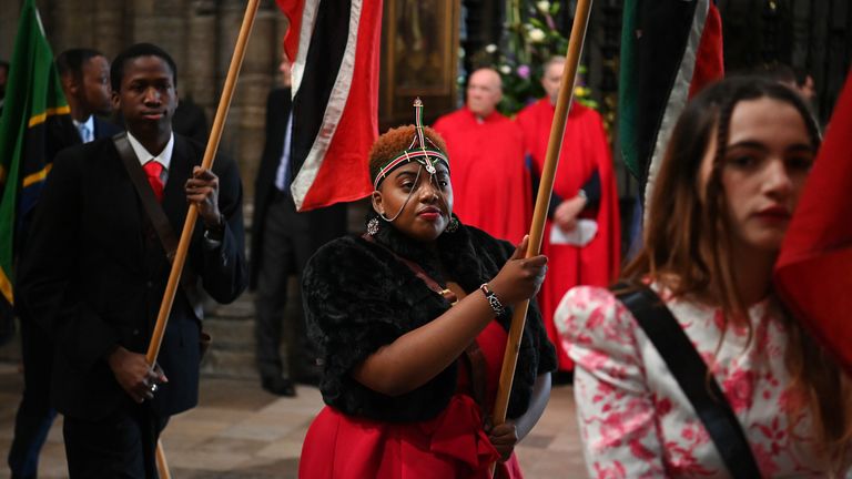 The flag bearers parade at the Commonwealth Service at Westminster Abbey in London on Commonwealth Day. Picture date: Monday March 14, 2022.