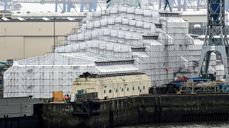 The 156 metres Dilbar superyacht owned by Russian billionaire Alisher Usmanov, lies in the Blohm & Voss dock in the harbor in Hamburg, Germany, March 3, 2022. REUTERS/Fabian Bimmer

