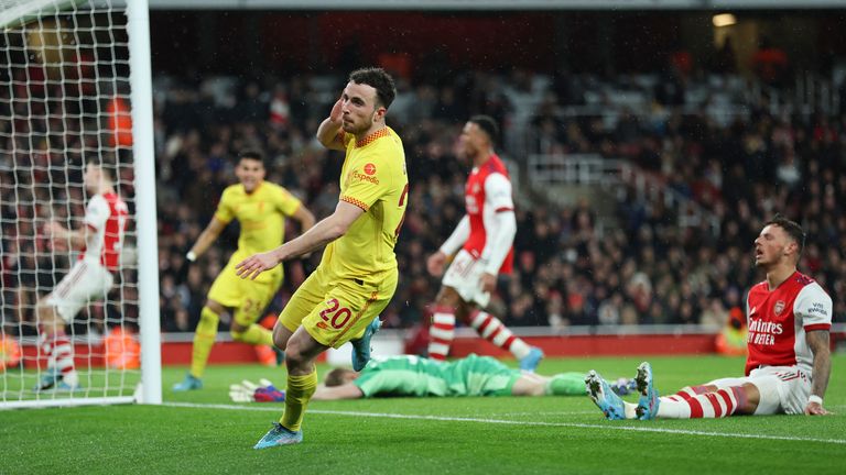 Liverpool&#39;s Diogo Jota reacts after scoring his team...s first goal during the English Premier League soccer match between Arsenal and Liverpool at Emirates Stadium in London, Wednesday, March 16, 2022. (AP Photo/Ian Walton)