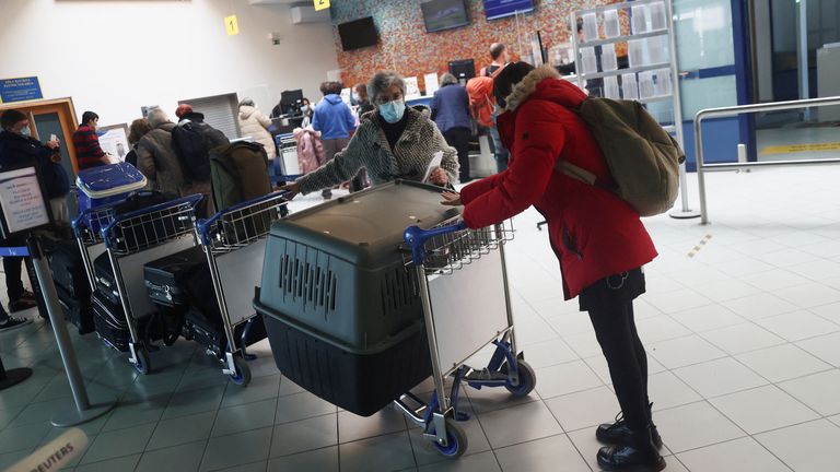 People were pictured at an airport on Sao Jorge as they prepare to leave the island before more disaster strikes 