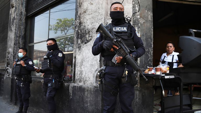 A patrol of officers of the National Civil Police guard the streets of the historic center in San Salvador, El Salvador, Sunday, March 27, 2022.The government of President Bukele authorized the Suspension of Rights and Freedoms in a decree approved by the Legislative Assembly to neutralize criminal groups related to the killings. (AP Photo/Salvador Melendez).