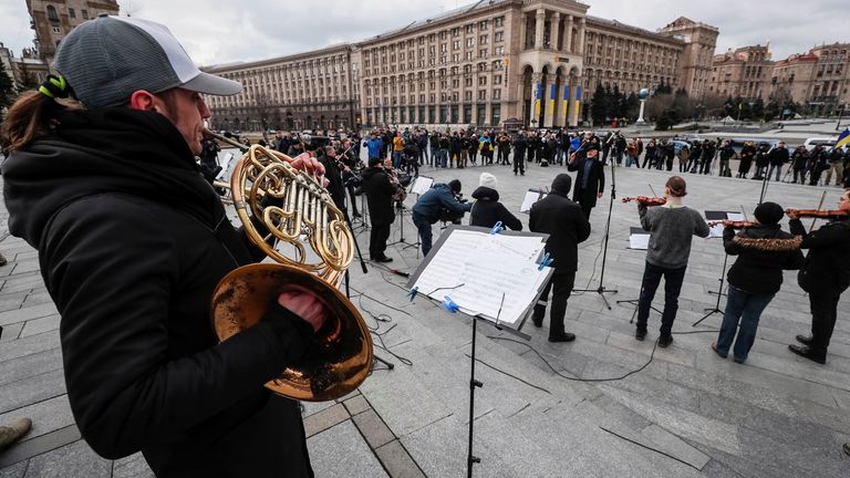 Musicians of the Kyiv-Classic Symphony Orchestra under the direction of conductor Herman Makarenko perform during an open-air concert named "Free Sky" at the Independence Square in central Kyiv, Ukraine March 9, 2022. REUTERS/Gleb Garanich
