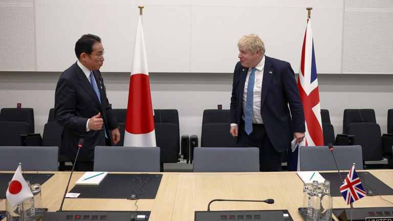 Japanese Prime Minister Fumio Kishida and British Prime Minister Boris Johnson attend a bilateral meeting during a NATO summit to discuss Russia&#39;s invasion of Ukraine, at the alliance&#39;s headquarters in Brussels, Belgium March 24, 2022. REUTERS/Henry Nicholls/Pool
