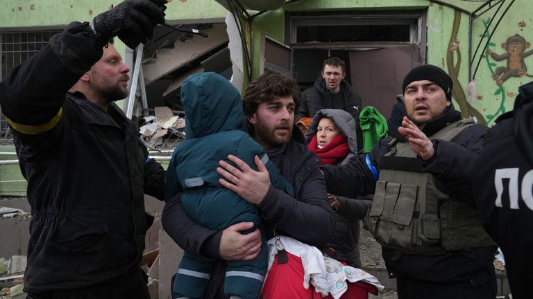 A man carries his child away from a damaged maternity hospital in Mariupol, Ukraine, Wednesday, March 9, 2022. (AP Photo/Evgeniy Maloletka)
PIC:AP
