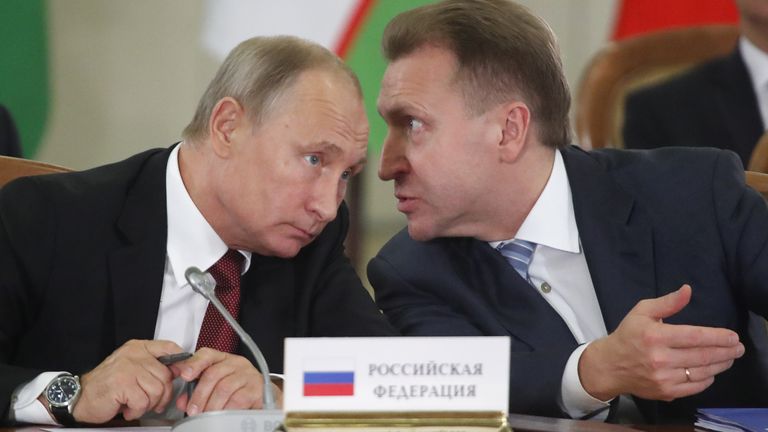 Russia&#39;s President Vladimir Putin (L) and First Deputy Prime Minister Igor Shuvalov speak during a session of the Council of Heads of the Commonwealth of Independent States (CIS) in Sochi, Russia October 11, 2017. REUTERS/Maxim Shemetov

