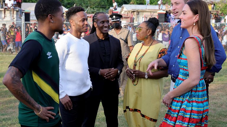 Prince William and Catherine, Duchess of Cambridge speak to Premier League stars Raheem Sterling and Leon Bailey during a visit to Trench Town, the birthplace of reggae music, on day four of the Platinum Jubilee Royal Tour of the Caribbean on March 22, 2022 in Kingston, Jamaica. Chris Jackson/Pool via REUTERS

