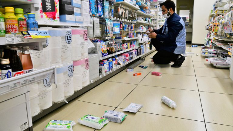 An employee clears products fallen from shelves at a convenience store in Iwaki, Fukushima prefecture, northern Japan Wednesday, March 16, 2022, following an earthquake. A powerful earthquake shook off the coast of Fukushima in northern Japan on Wednesday, triggering a tsunami advisory. (Kyodo News via AP)
Pic:AP

