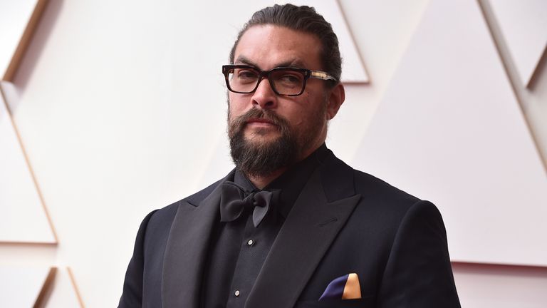 Jason Momoa wears a blue and yellow pocket square in solidarity. Pic: AP