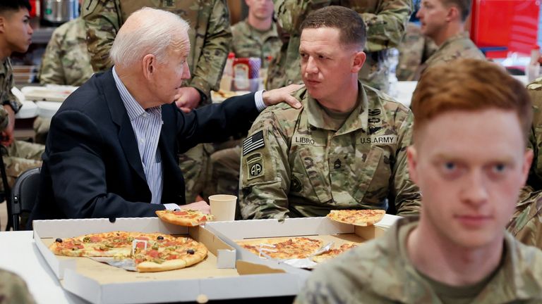 U.S. President Joe Biden meets with U.S. Army soldiers assigned to the 82nd Airborne Division at the G2 Arena in Jasionka, near Rzeszow, Poland, March 25, 2022. REUTERS/Evelyn Hockstein
