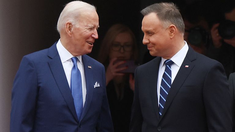 Polish President Andrzej Duda (R) welcomes the US President Joe Biden to Warsaw
