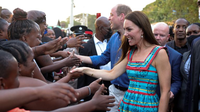 The Duke and Duchess of Cambridge shake hands with locals during a visit Trench Town