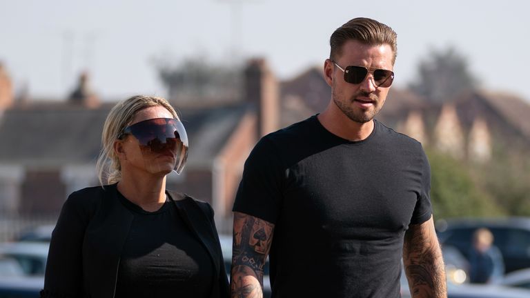Carl Woods arrives at Colchester Magistrates&#39; Court, Essex, alongside partner Katie Price, where he is appearing charges under Section 4 of the Public Order Act. Picture date: Wednesday March 23, 2022.