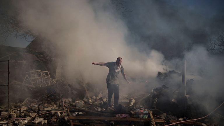 A man walks on the debris of a burning house, destroyed after a Russian attack in Kharkiv, Ukraine, Thursday, March 24, 2022. (AP Photo/Felipe Dana)
PIC:AP

