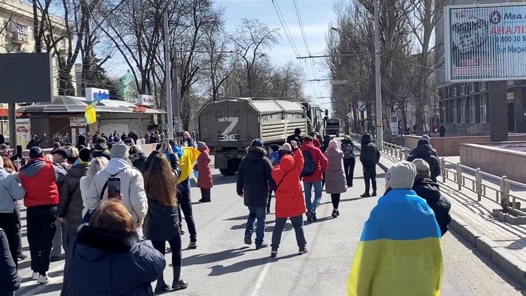 Protesters confront Russian military vehicles in Kherson