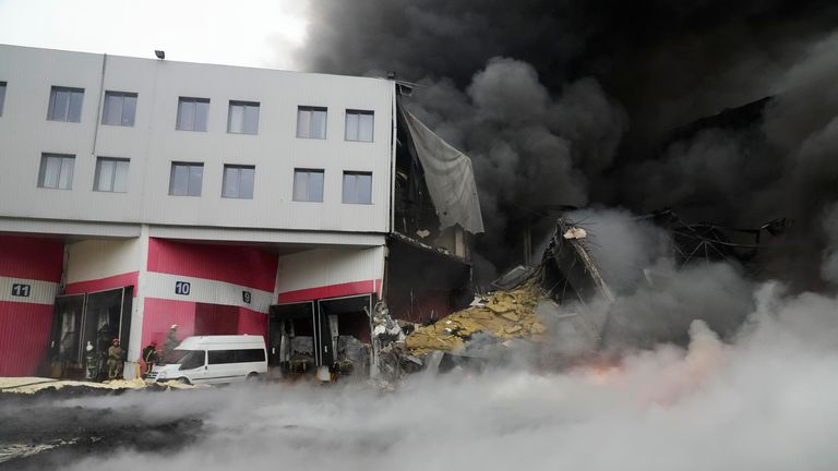 Firefighters work to extinguish a fire at a damaged logistic centre after shelling in Kyiv, Ukraine, Thursday, March 3, 2022. Russia has launched a wide-rangingattack on Ukraine, hitting cities and bases with airstrikes or shelling. (AP Photo/Efrem Lukatsky)

Pic:AP
