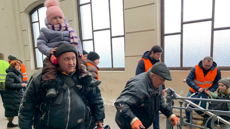 People fleeing war-torn Ukraine amid Russia&#39;s invasion arrive at a platform for a train bound for Poland on March 2, 2022 in Lviv, western Ukraine. (Kyodo via AP Images) ==Kyodo


